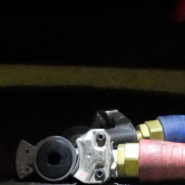 Two gladhand couplings with rubber seals on red and blue air lines